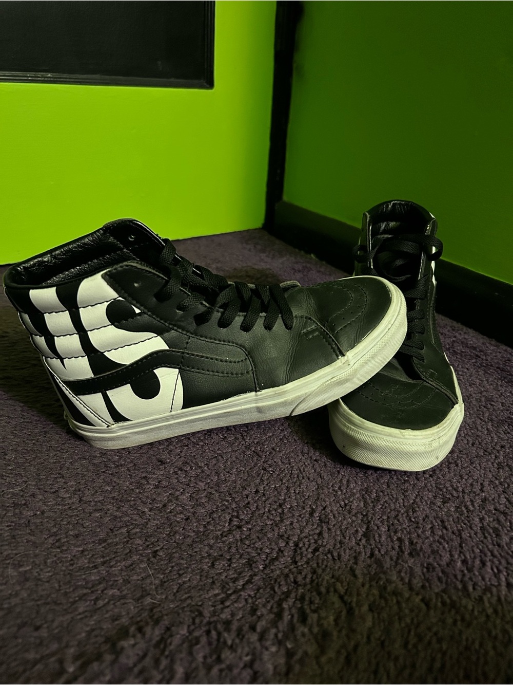 Black and White Vans Leather High Tops